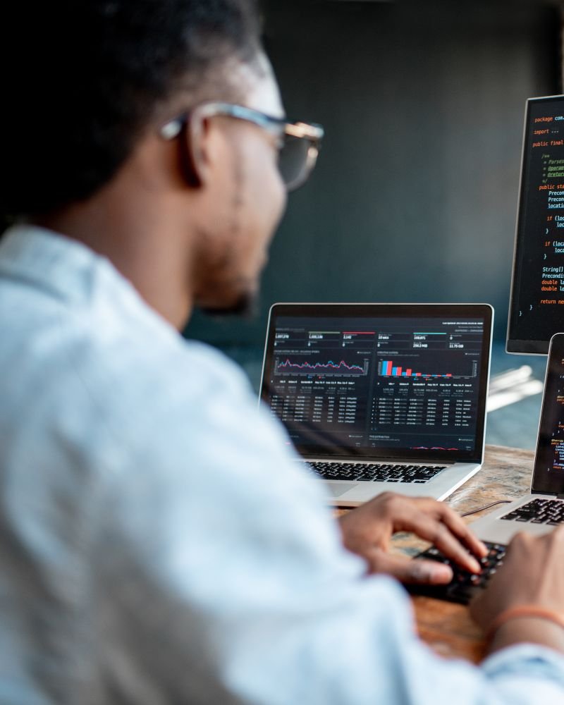 a man developing website in laptop